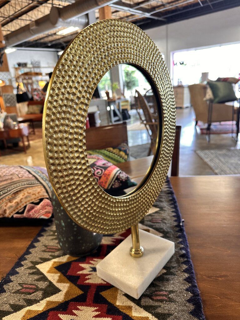 Hammered Bronze Mirror on Marble