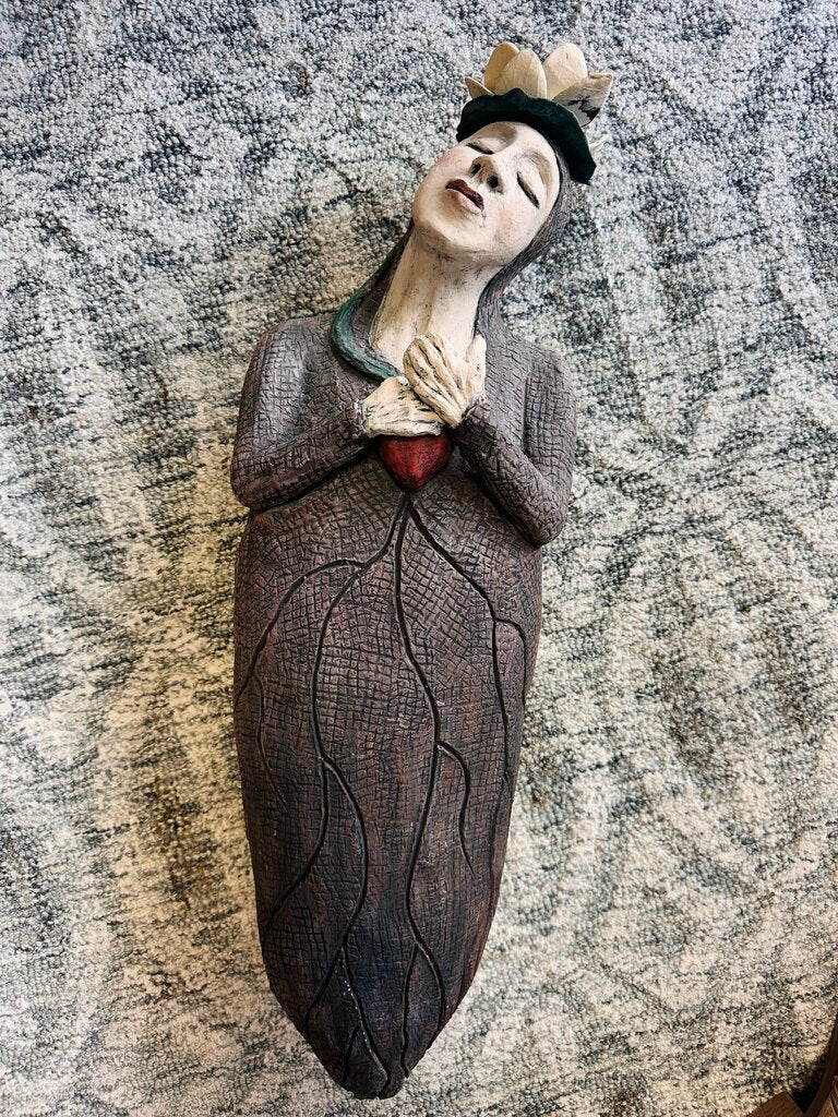 Sculpture Woman Holding Her Heart